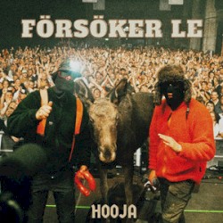 Försöker le