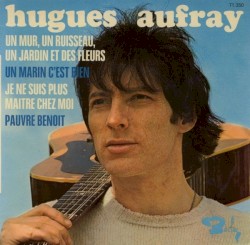 Un mur, un ruisseau, un jardin et des fleurs