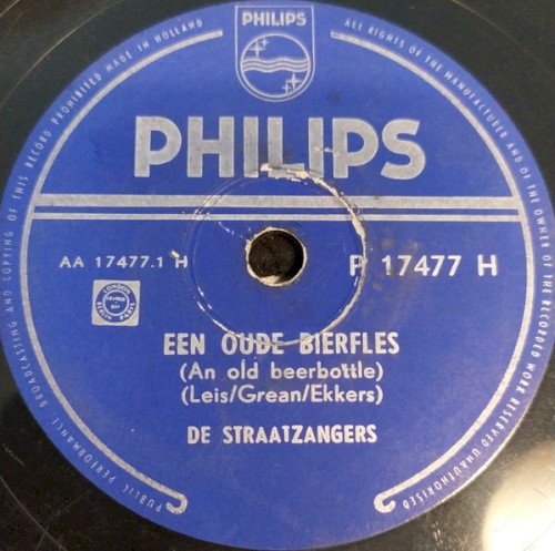 Een oude bierfles / De schooier en zijn hond