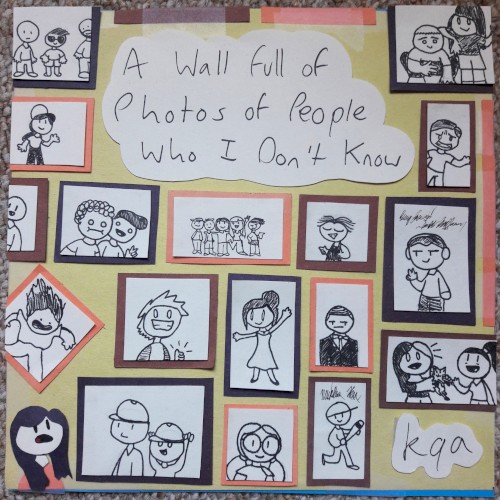 A Wall full of Photos of People Who I Don't Know