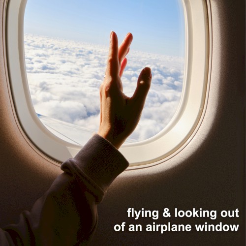 flying & looking out of an airplane window