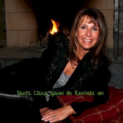 Santa Claus, spann die Rentiere ein